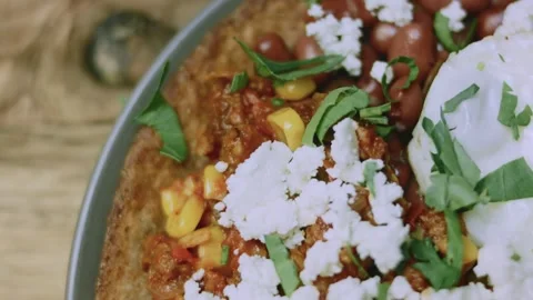 Delicate cooking view of overhead Mexican breakfast on a rustic table Stock Footage 342153039