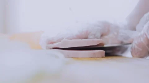 Delicate culinary close-up: seasoning sweet potato slices by hand Stock Footage 342195508
