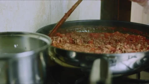 Delicate culinary study of pouring white rice into a saucepan Stock Footage 342153470