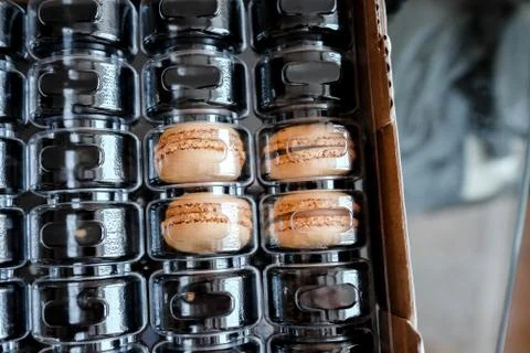 Delicate dessert in packaging for transportation under a transparent lid. 스톡 사진