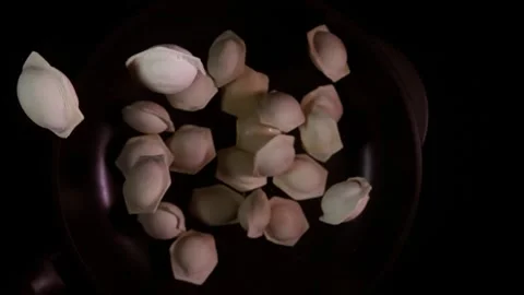 Delicate Dumplings Floating Gracefully in the Air at Culinary Workshop Stock Footage 282521772
