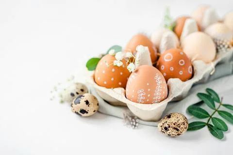 A delicate Easter background with hand-painted eggs Stock Photos