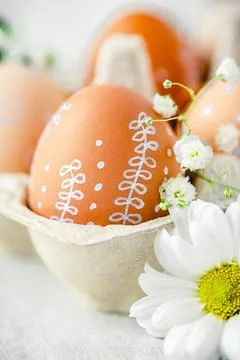 A delicate Easter background with hand-painted eggs Stock Photos