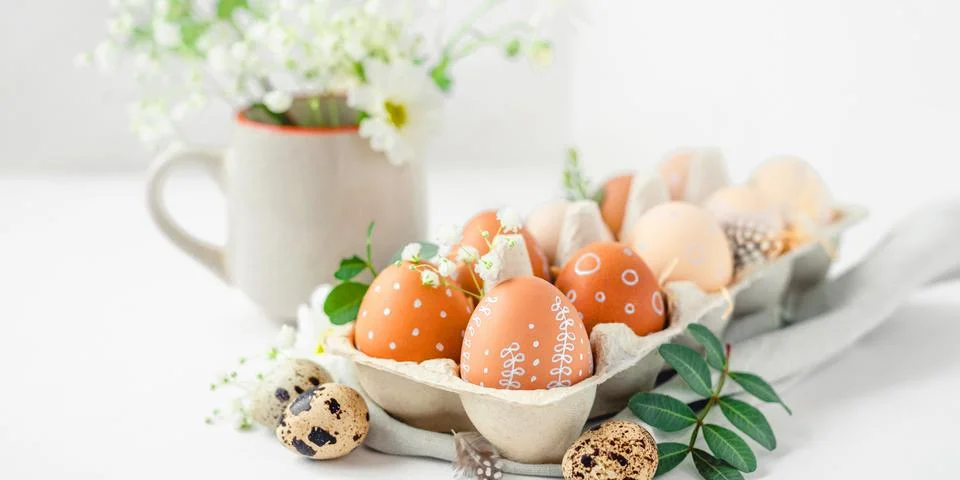 A delicate Easter background with hand-painted eggs Stock Photos
