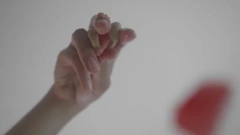 Delicate Hand Holding Small Object Stock Footage 314786716
