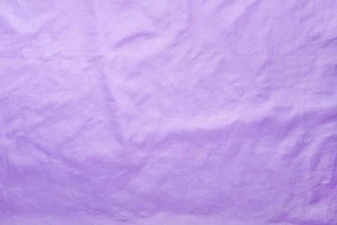 Delicate lilac silk texture. Slightly wrinkled fabric background Fotos Stock