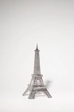 Delicate metal Eiffel Tower model on white background 写真素材