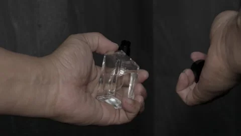 Delicate Mist: Spraying Perfume onto Hand 库存影片 252240442