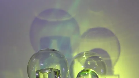 Delicate orbs move in slow patterns, bending light in every direction. Stock Footage 302411148