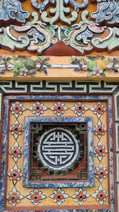Delicate patterns of porcelain mosaic art at Hue Imperial city, Vertical shot Stock Footage 313486301