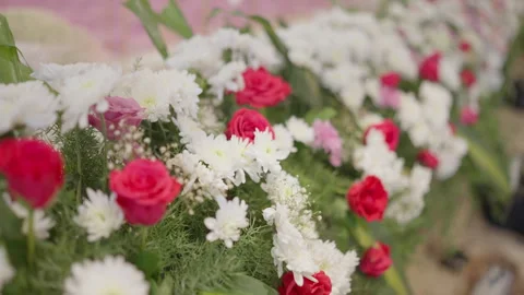 Delicate pink red and white flower garland arrangement decorating Indian Stock Footage 341402214