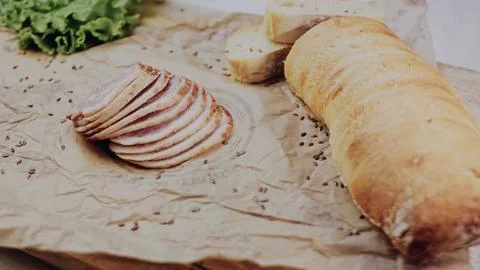 Delicate recipe demonstration: adding crisp vegetables to a sandwich Stock Photos