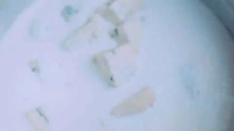Delicate recipe study: melting a creamy elote topping Stock Footage 342171563