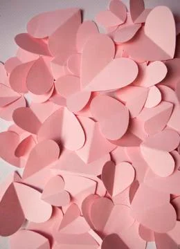 Delicate romantic background of pink paper hearts Stock Photos