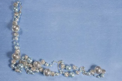 Delicate satin background with beads Stock Photos