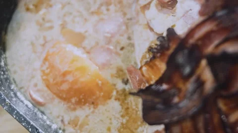 Delicate seasonal cooking: serving thick slices of bacon wrapped tenderloin Stock Footage 342185765
