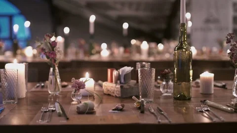 Delicate serving exquisite dinner table for elegant banquet with candles Stock Footage 71502636