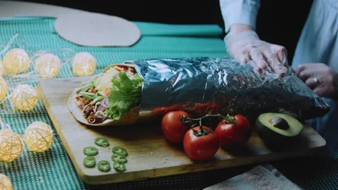 Delicate serving view: showing the colorful burrito cross section Stock Footage 342168163