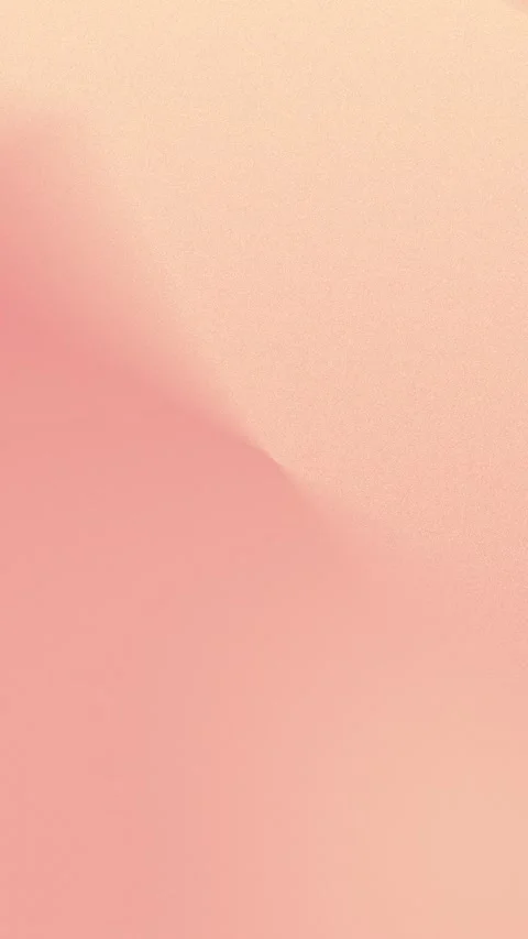 Delicate soft pink gradient with subtle sandy texture creates a calming seamless Stockbeeldmateriaal 310143452