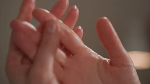 Delicate touch with inviting glow. Refined portrayal of tender gestures enhanced Stock Footage 337310363