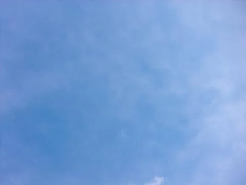Delicate Wispy Clouds Across a Soft Blue Daytime Sky Stock Photos
