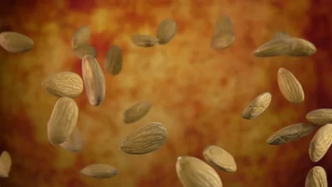Delicious almonds are bouncing on a yellow ochre background Stock Footage 133925355