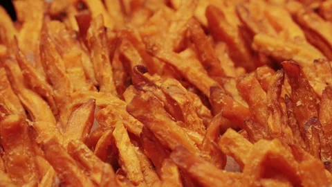 Delicious and Crispy Sweet Potato Fries Served in Paper Cups for Your Enjoyment Stock Footage 285646397