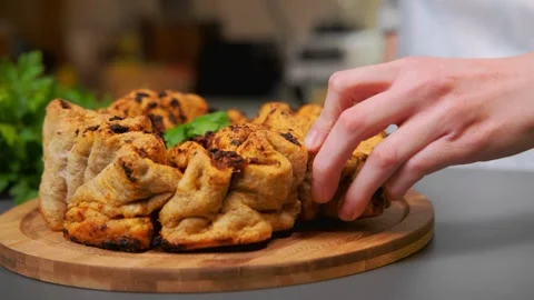 Delicious and crispy tomato bread lies on a cutting board Stock-Footage 252486682