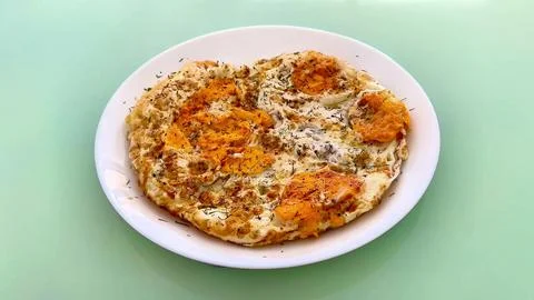 A Delicious and NutrientRich Egg Dish Prepared with Fresh Herbs and Flavorful Stock Photos