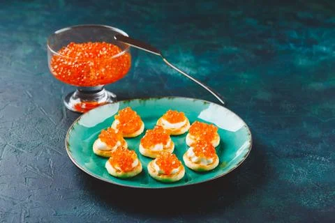 Delicious appetizer with red caviar. Stock Photos