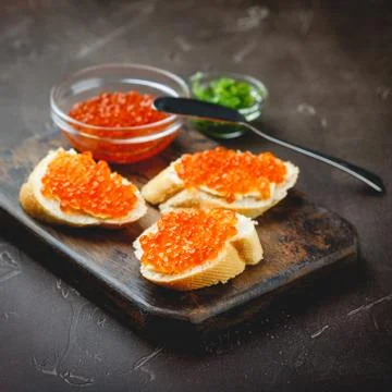 Delicious appetizer with red caviar. Stock Photos