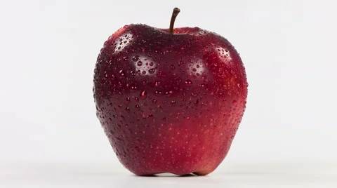Delicious appetizing beautiful apples close up rotation on a white background. Stock Footage 64345408