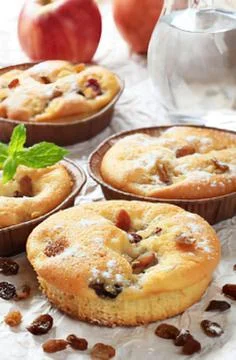 Delicious apple cinnamon muffins on rustic tray Stock Photos