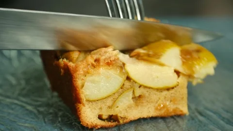 Delicious apple dessert slice on blue plate, featuring golden apple pieces Stock-Footage 317905833