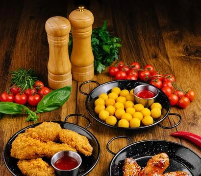 Delicious array of appetizers served on rustic wooden table Fotos de archivo