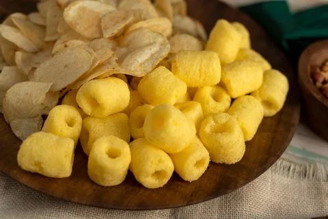 Delicious array of assorted nuts and snacks on wooden plates Foto stock