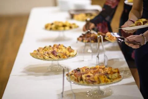 Delicious array of assorted small pizzas and appetizers served on elegant gla Foto stock