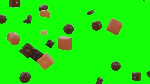 A Delicious Array Of Chocolates And Treats Falling Down A Flowing on Green 動画素材 138902616