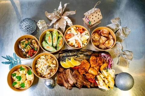 Delicious array of festive dishes on a metallic surface Stock Photos
