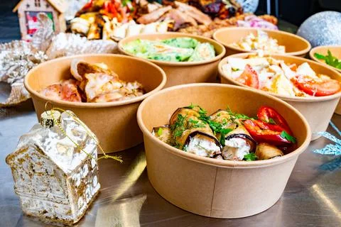 Delicious array of festive dishes served in eco-friendly containers Stock Photos