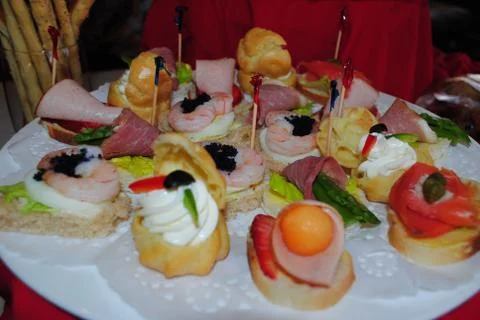 Delicious array of seafood and ham slices starters Stock Photos