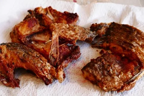 Delicious asian fried fish, with crispy crust. Stock Photos