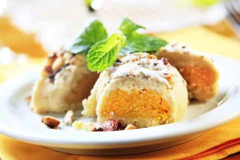 Delicious baked dessert with mint garnish on plate Stock Photos