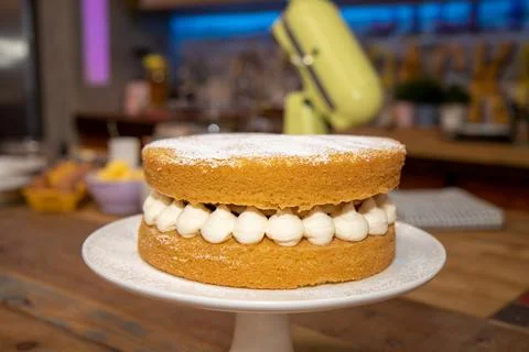 A delicious basic sponge cake with cream in a kitchen Stock Photos