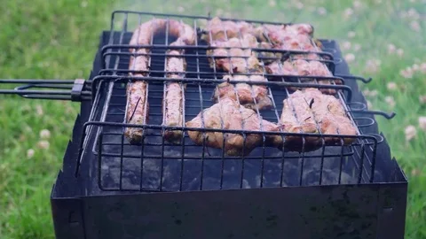 Delicious bbq kebab grilling on open grill, outdoor kitchen. Stock Footage 77596993