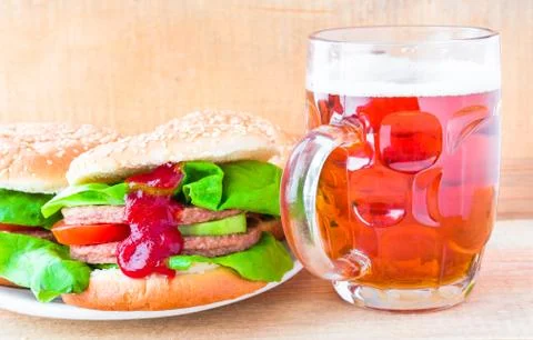 Delicious beef hamburger mug beer Stock Photos