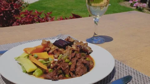 Delicious beef meat with grill vegetables on a white plate. Video stock 247513688
