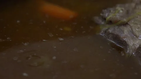 Delicious beef stew simmering in a pot Stock Footage 335472001