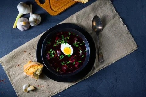 Delicious beetroot borscht with egg Stock Photos