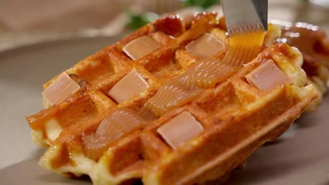 Delicious Belgian waffles covered with soft caramel sauce. Concept of crunchy Stock Footage 276821264